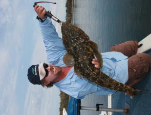 The author about to release a superb 92cm flattie. Fish of this size should always be handled with care before release. 